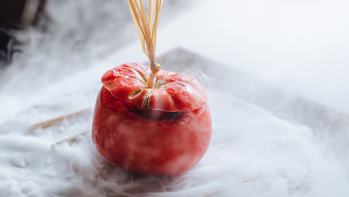 A Red Apple On A plate at Chedi Lustica bay restaurant.