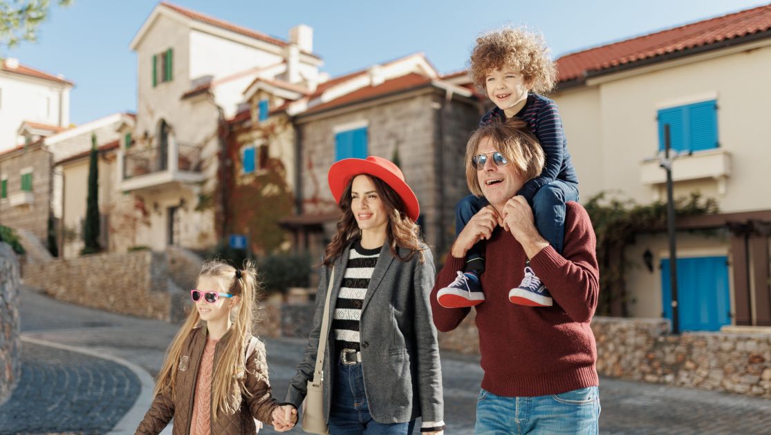 Image for a family walking at chedi lustica bay