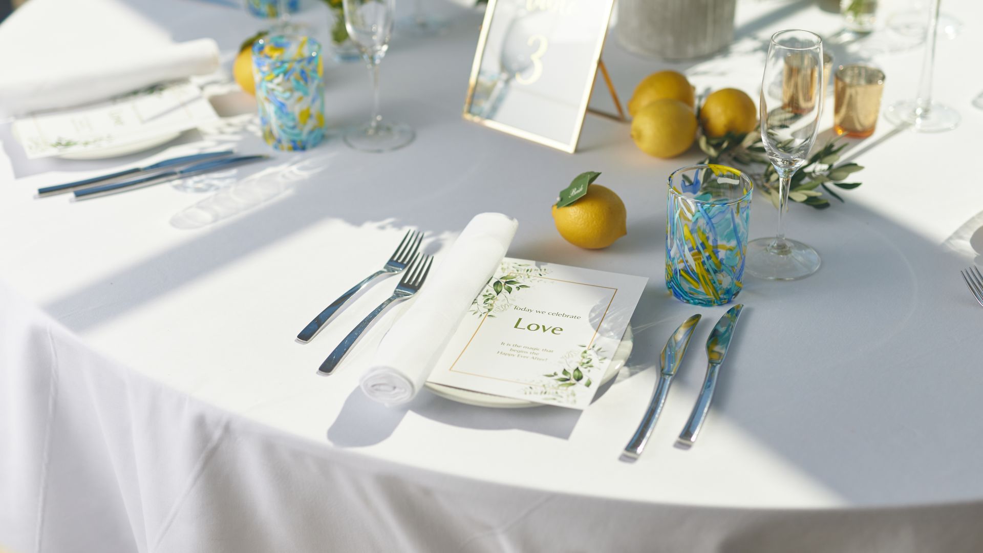 A Table Set With Silverware And Silverware