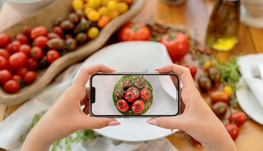 Hands Holding A phone and taking a photo of a fresh vegetables 